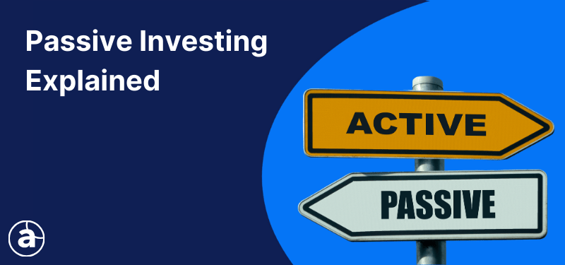Two road signs pointing in different directions, one reads "Active", the other reads "Passive". White text in the background reads: "Passive Investing Explained".
