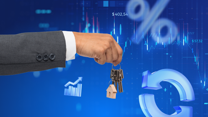 A hand holding a pair of house keys on a blue background.