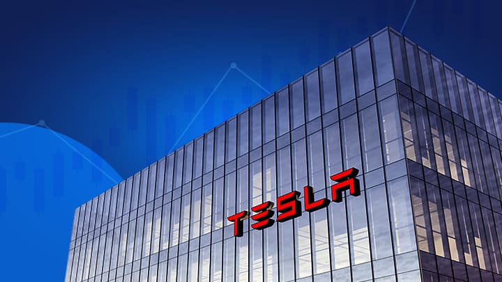 Tesla részvény vásárlás Magyarországon, a képen kék háttérrel egy épület Tesla felirattal.