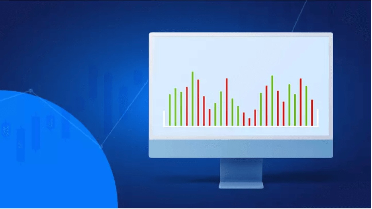 Computador com gráficos vermelhos e verdes que explica como usar o indicador de volume financeiro