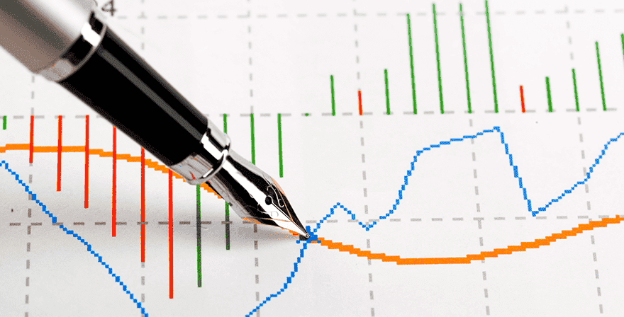 Stylo plume avec un graphique de trading en arrière plan